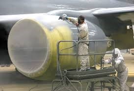 workers wearing protective gear while applying AcraStrip 600 Military to a very large section of a plane