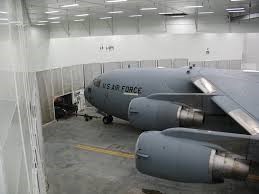 a military aircraft in an indoor facility
